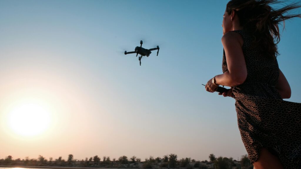 Women flying a drone in the sky